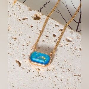 Gold Tone Necklace with Blue Stone Pendant